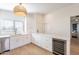 White kitchen with quartz countertops and wine cooler at 1132 W 21St Ave, Apache Junction, AZ 85120