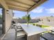 Outdoor patio with seating area and modern table at 1132 W 21St Ave, Apache Junction, AZ 85120