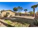 Backyard view of home with grassy area and block wall at 1133 E Dust Devil Dr, San Tan Valley, AZ 85143