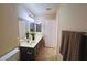 Bathroom with double sink vanity and plenty of lighting at 1133 E Dust Devil Dr, San Tan Valley, AZ 85143