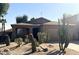 Southwestern-style home with desert landscaping, neutral color palette, and attached garage at 1133 E Dust Devil Dr, San Tan Valley, AZ 85143