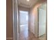 Hallway with tile flooring leading to bedrooms at 1133 E Dust Devil Dr, San Tan Valley, AZ 85143