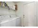 Laundry room with washer, dryer, and overhead shelving at 1133 E Dust Devil Dr, San Tan Valley, AZ 85143