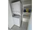 Stackable washer and dryer with storage shelving at 12221 W Bell Rd # 363, Surprise, AZ 85378