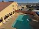 Community pool and spa with lounge chairs at 12221 W Bell Rd # 363, Surprise, AZ 85378