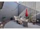 Private patio with seating area and decorative screen at 1241 E Medlock Dr # 110, Phoenix, AZ 85014