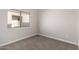 Spacious bedroom with window and neutral colored walls at 13859 N 91St Ln, Peoria, AZ 85381