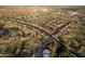 Aerial view of homes and golf course in a community at 147 S Los Cielos Ln, Casa Grande, AZ 85194