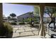 Landscaped backyard with flagstone patio and pool at 147 S Los Cielos Ln, Casa Grande, AZ 85194