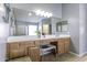 Double vanity bathroom with large mirror and ample storage at 147 S Los Cielos Ln, Casa Grande, AZ 85194