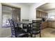 Bright breakfast nook with table and chairs next to kitchen at 147 S Los Cielos Ln, Casa Grande, AZ 85194