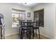 Cozy breakfast nook with table and four chairs near window at 147 S Los Cielos Ln, Casa Grande, AZ 85194