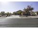 One-story house with a driveway and street view at 147 S Los Cielos Ln, Casa Grande, AZ 85194