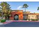 Community center entrance with landscaping and palm trees at 147 S Los Cielos Ln, Casa Grande, AZ 85194