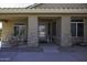 Covered porch with stone pillars and seating area at 147 S Los Cielos Ln, Casa Grande, AZ 85194