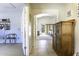 Hallway with tiled floor and view of living room at 147 S Los Cielos Ln, Casa Grande, AZ 85194