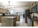 Updated kitchen featuring stainless steel appliances and island at 147 S Los Cielos Ln, Casa Grande, AZ 85194