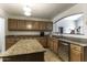 Kitchen with granite countertops and stainless steel appliances at 147 S Los Cielos Ln, Casa Grande, AZ 85194