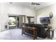 Bright living room with high ceilings, sliding glass door, and comfortable seating arrangement at 147 S Los Cielos Ln, Casa Grande, AZ 85194