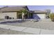 Gravel yard with desert landscaping and walkway at 147 S Los Cielos Ln, Casa Grande, AZ 85194