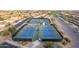 Aerial view of four well-maintained tennis courts at 147 S Los Cielos Ln, Casa Grande, AZ 85194