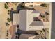 Overhead view of single-story house with tile roof and covered patio at 15220 W Blue Verde Dr, Sun City West, AZ 85375