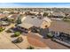 Aerial view of a house with a covered patio and landscaped yard at 15220 W Blue Verde Dr, Sun City West, AZ 85375