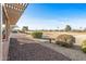 Landscaped backyard with view of golf course at 15220 W Blue Verde Dr, Sun City West, AZ 85375