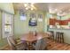 Casual dining area with wood table and chairs at 15220 W Blue Verde Dr, Sun City West, AZ 85375