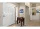 Bright and airy entryway with a console table and access to other rooms at 15220 W Blue Verde Dr, Sun City West, AZ 85375