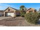 House exterior showcasing a garage, landscaping, and walkway at 15220 W Blue Verde Dr, Sun City West, AZ 85375