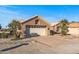 Front view of a single-story house with a two-car garage at 15220 W Blue Verde Dr, Sun City West, AZ 85375