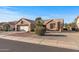 One-story home with a two-car garage and desert landscaping at 15220 W Blue Verde Dr, Sun City West, AZ 85375