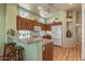 Modern kitchen with granite countertops and wooden cabinets at 15220 W Blue Verde Dr, Sun City West, AZ 85375