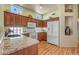 Kitchen with granite countertops and wood cabinets at 15220 W Blue Verde Dr, Sun City West, AZ 85375