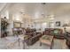 Spacious living room with leather furniture and a wood coffee table at 15220 W Blue Verde Dr, Sun City West, AZ 85375