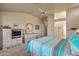 Main bedroom with carpet flooring and built-in media cabinet at 15220 W Blue Verde Dr, Sun City West, AZ 85375