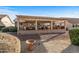 Relaxing patio with pergola and outdoor furniture at 15220 W Blue Verde Dr, Sun City West, AZ 85375