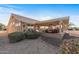 Spacious backyard patio with pergola and seating area at 15220 W Blue Verde Dr, Sun City West, AZ 85375