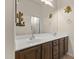 Double vanity bathroom with ample storage and a modern design at 15240 N 142Nd Ave # 2159, Surprise, AZ 85379