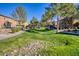 Landscaped community with grassy areas, trees and sidewalks at 15240 N 142Nd Ave # 2159, Surprise, AZ 85379