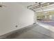 Bright and clean garage with open door showing the exterior at 15240 N 142Nd Ave # 2159, Surprise, AZ 85379