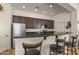 Kitchen boasts granite countertops and dark wood cabinets at 15240 N 142Nd Ave # 2159, Surprise, AZ 85379