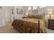 Spacious main bedroom with a king-size bed and ensuite bathroom access at 15240 N 142Nd Ave # 2159, Surprise, AZ 85379