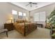 Large main bedroom with a king-size bed and plenty of natural light at 15240 N 142Nd Ave # 2159, Surprise, AZ 85379