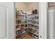 Well-organized pantry with ample shelving for food storage at 15240 N 142Nd Ave # 2159, Surprise, AZ 85379