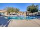 Inviting community swimming pool with surrounding patio at 15240 N 142Nd Ave # 2159, Surprise, AZ 85379