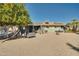 Backyard view showing home, patio, and mature fruit trees at 15489 N Ridgeview Rd, Sun City, AZ 85351