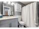 Clean bathroom with white shower curtain and vanity at 15489 N Ridgeview Rd, Sun City, AZ 85351