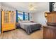 Bright bedroom with wood accents and a ceiling fan at 15489 N Ridgeview Rd, Sun City, AZ 85351